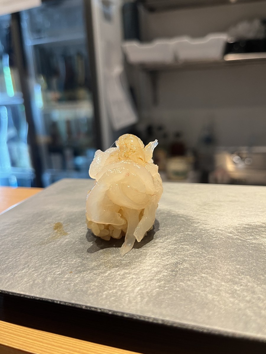 A piece of shiroebi (white shrimp) nigiri at Akira