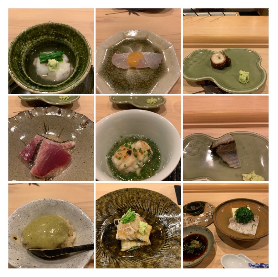 A grid of small washoku tsumami dishes — dressed sashimi, simmered vegetables, and seasonal cooked plates