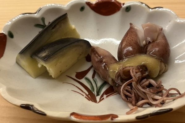 A plate of simmered eggplant and small firefly squid