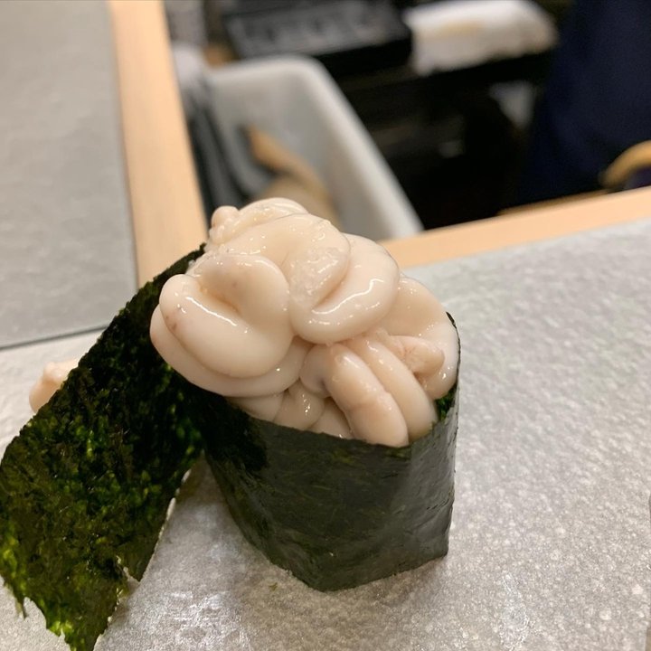 A shirako gunkan, nori-wrapped sushi topped with creamy cod milt