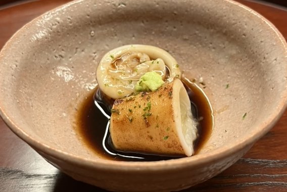 Komochi ika, squid stuffed with its own roe, in a dark dashi with wasabi